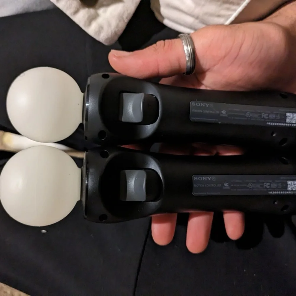 hardly used VR with the two controllers and all the cords with Spider-Man VR